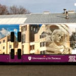 A wrapped University of St. Thomas bus featuring custom printed exterior from Printastik in Edina, MN